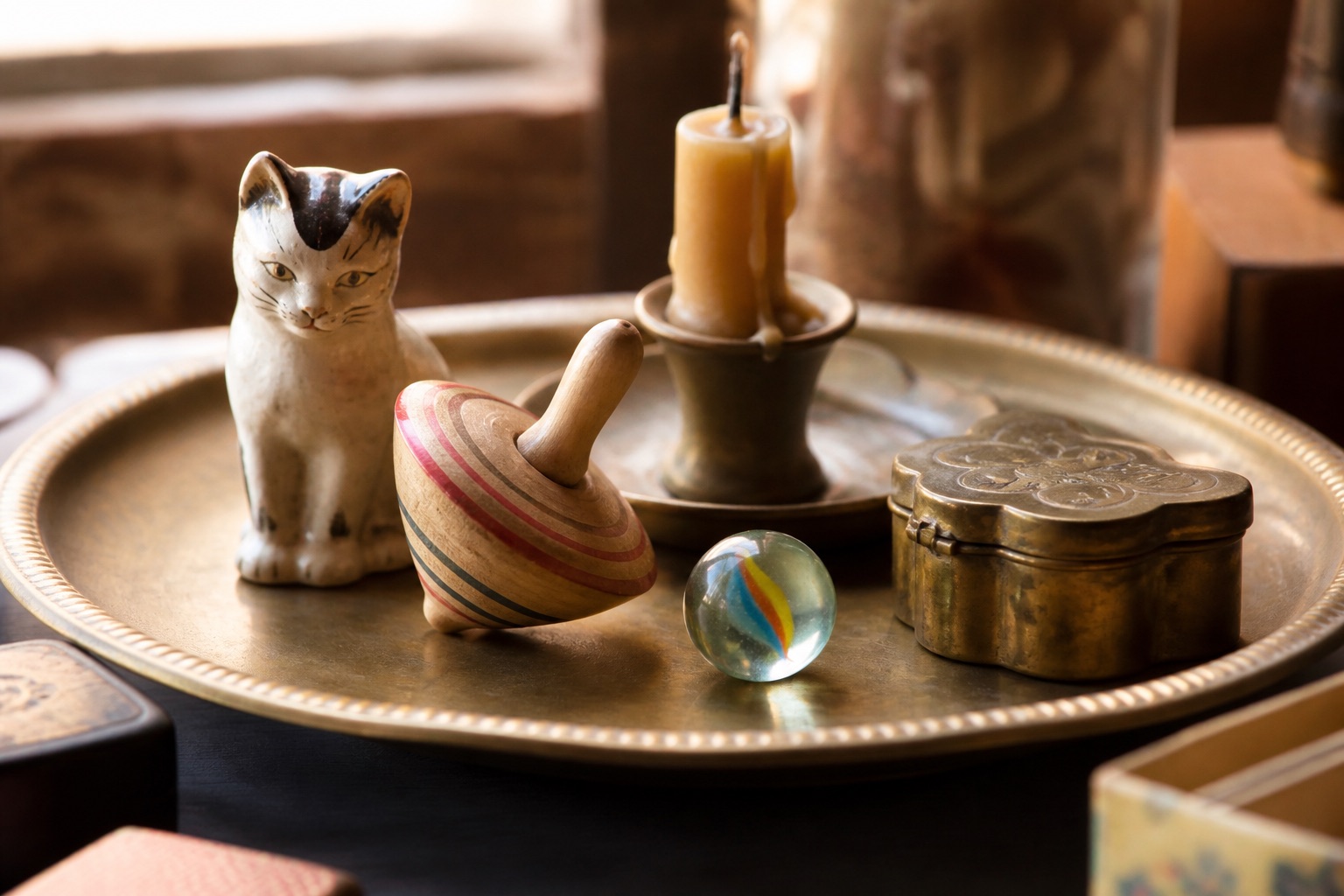 Ceramic figurine, wooden top, marble, candle, and brass trinket box